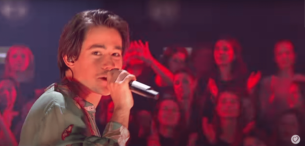 The lead singer of Joker Out in an audience full of young women.